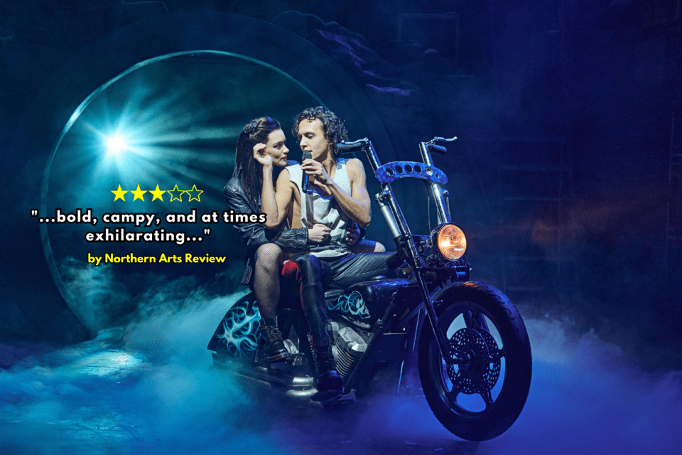 Man and woman sing and embrace on a motorbike during Bat out Of Hell Stageplay