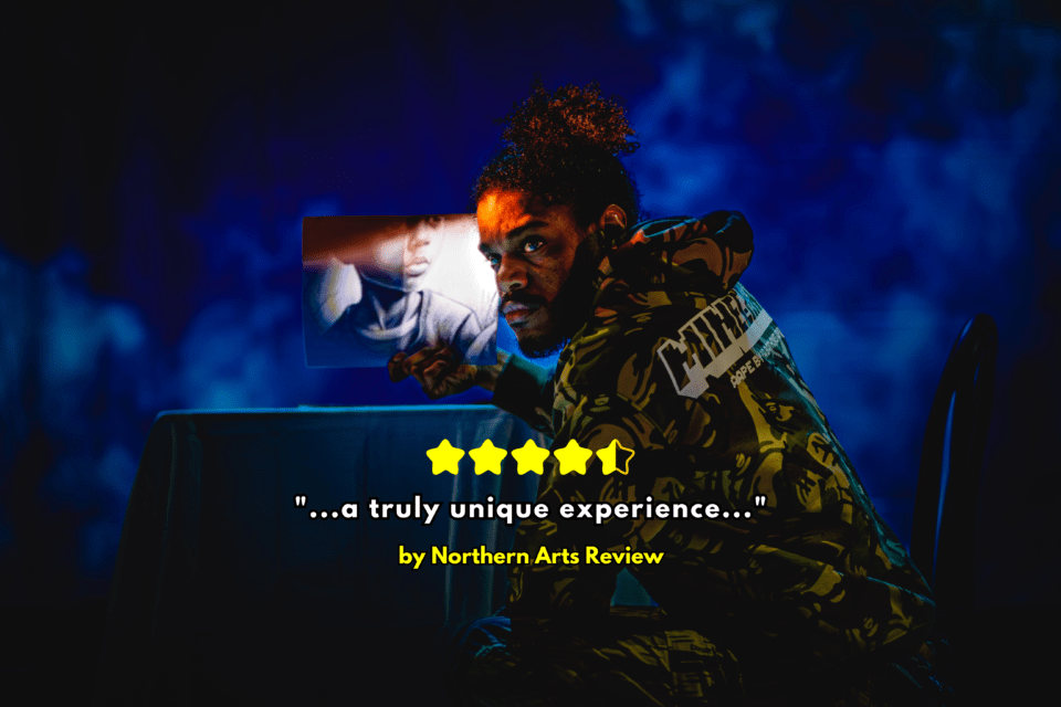 A man on stage with dramatic lighting in All Blood Runs Red