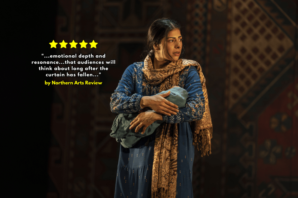 Image of a woman wearing traditional Afghan dress on stage at a production of "A Thousand Splendid Suns"
