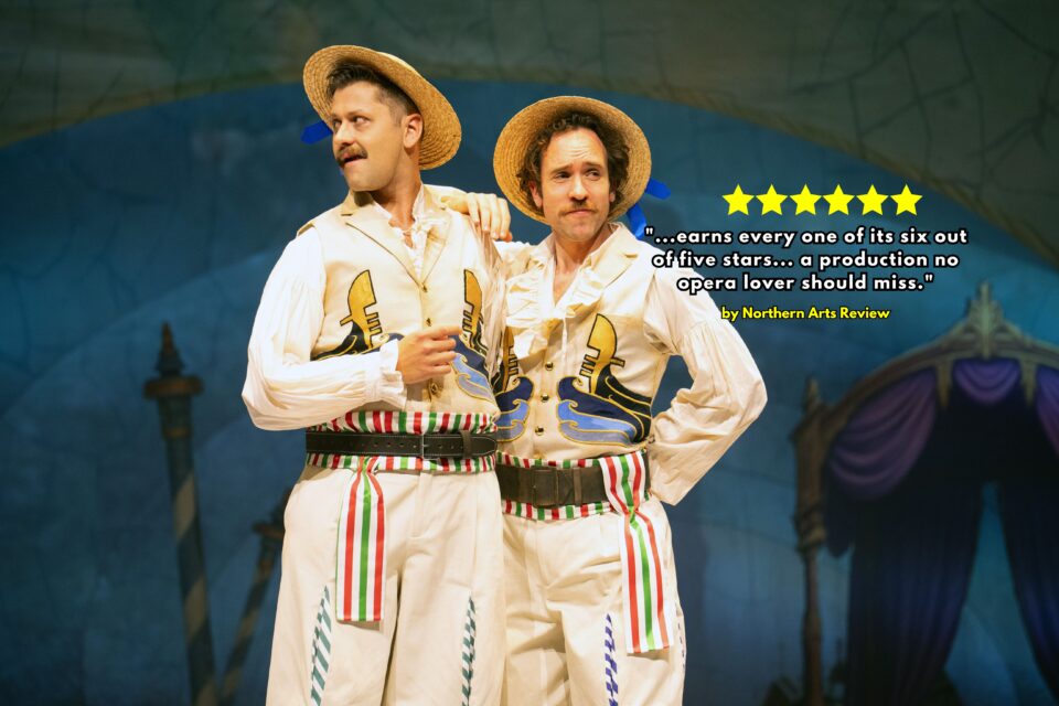 Two gondoliers from the English Touring Opera performance wearing white outfits and boat hats
